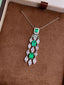 14K GOLD 1.25 CTW VIVID GREEN NATURAL EMERALD & DIAMOND PENDANT