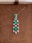 14K GOLD 1.25 CTW VIVID GREEN NATURAL EMERALD & DIAMOND PENDANT