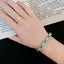 14K GOLD 6.11 CTW VIVID GREEN NATURAL EMERALD & DIAMOND BRACELET