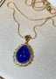 14K GOLD 29.58 CTW NATURAL TANZANITE & DIAMOND PENDANT