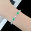 14K GOLD 6.18 CTW VIVID GREEN NATURAL EMERALD & DIAMOND BRACELET