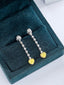 14K GOLD 0.77 CTW NATURAL YELLOW DIAMOND & DIAMOND EARRINGS