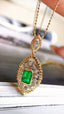 14K GOLD 0.78 CTW VIVID GREEN NATURAL EMERALD & DIAMOND PENDANT