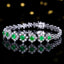 14K GOLD 3.55 CTW VIVID GREEN NATURAL EMERALD & SAPPHIRE BRACELET