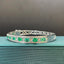 14K GOLD 4.03 CTW NATURAL EMERALD & DIAMOND BANGLE