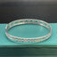 14K GOLD 4.03 CTW NATURAL EMERALD & DIAMOND BANGLE